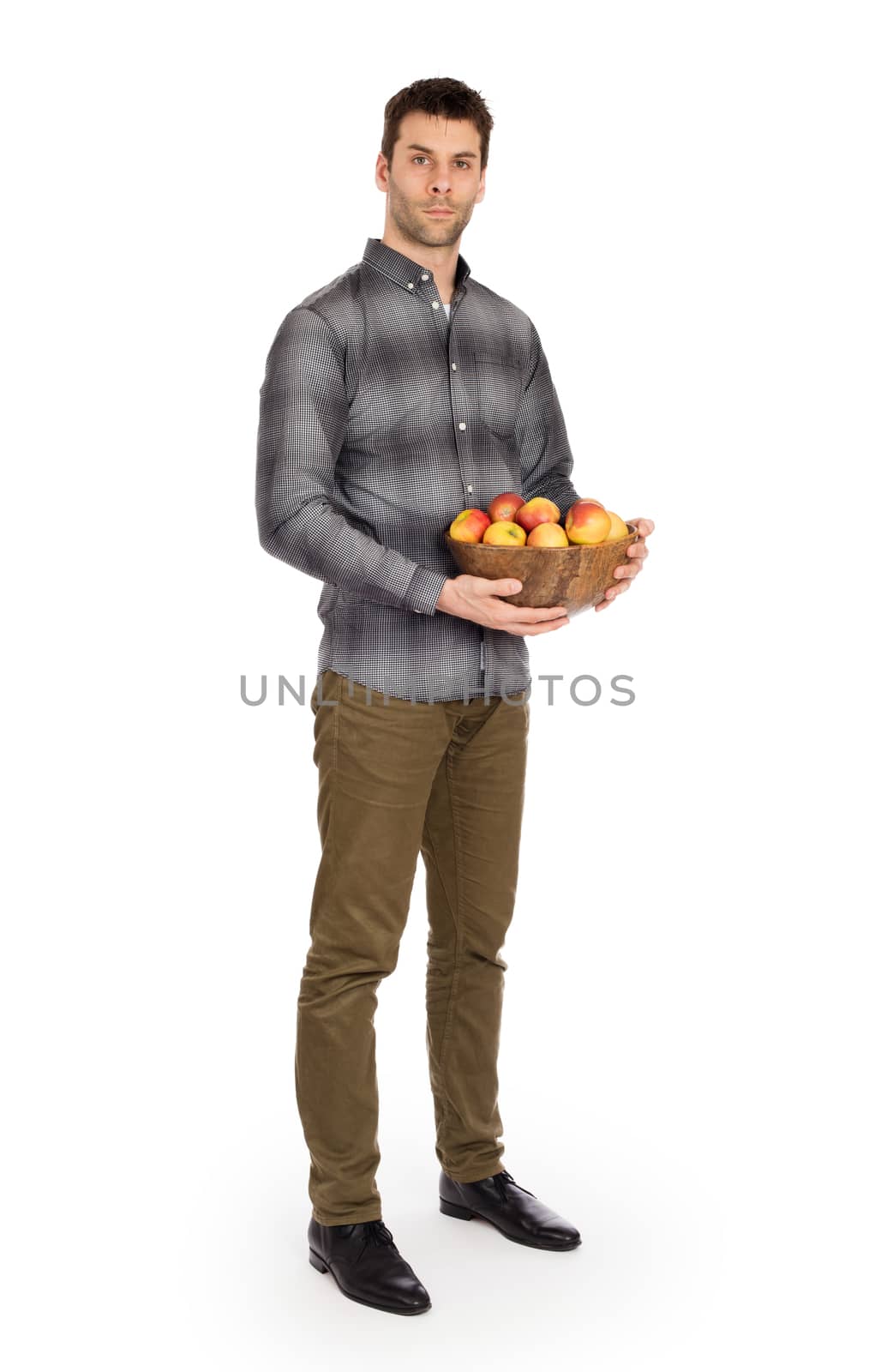 Healthy man with bowl full of apples, isolated on white