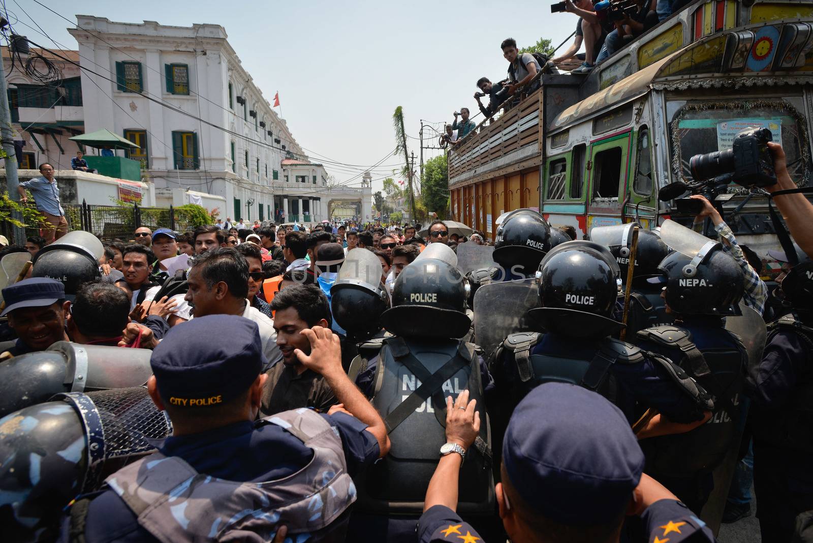 NEPAL, Kathmandu: Nepalese police push back demonstrators protesting against delayed government reconstruction efforts in Kathmandu on April 24, 2016, a year after a devastating earthquake. Nepal held memorial services on April 24 for the thousands killed in a massive earthquake one year ago, as victims still living in tents accused the government of failing them.