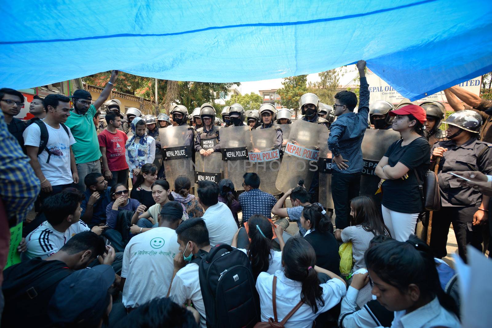 NEPAL, Kathmandu: Nepalese police contains demonstrators protesting against delayed government reconstruction efforts in Kathmandu on April 24, 2016, a year after a devastating earthquake. Nepal held memorial services on April 24 for the thousands killed in a massive earthquake one year ago, as victims still living in tents accused the government of failing them.