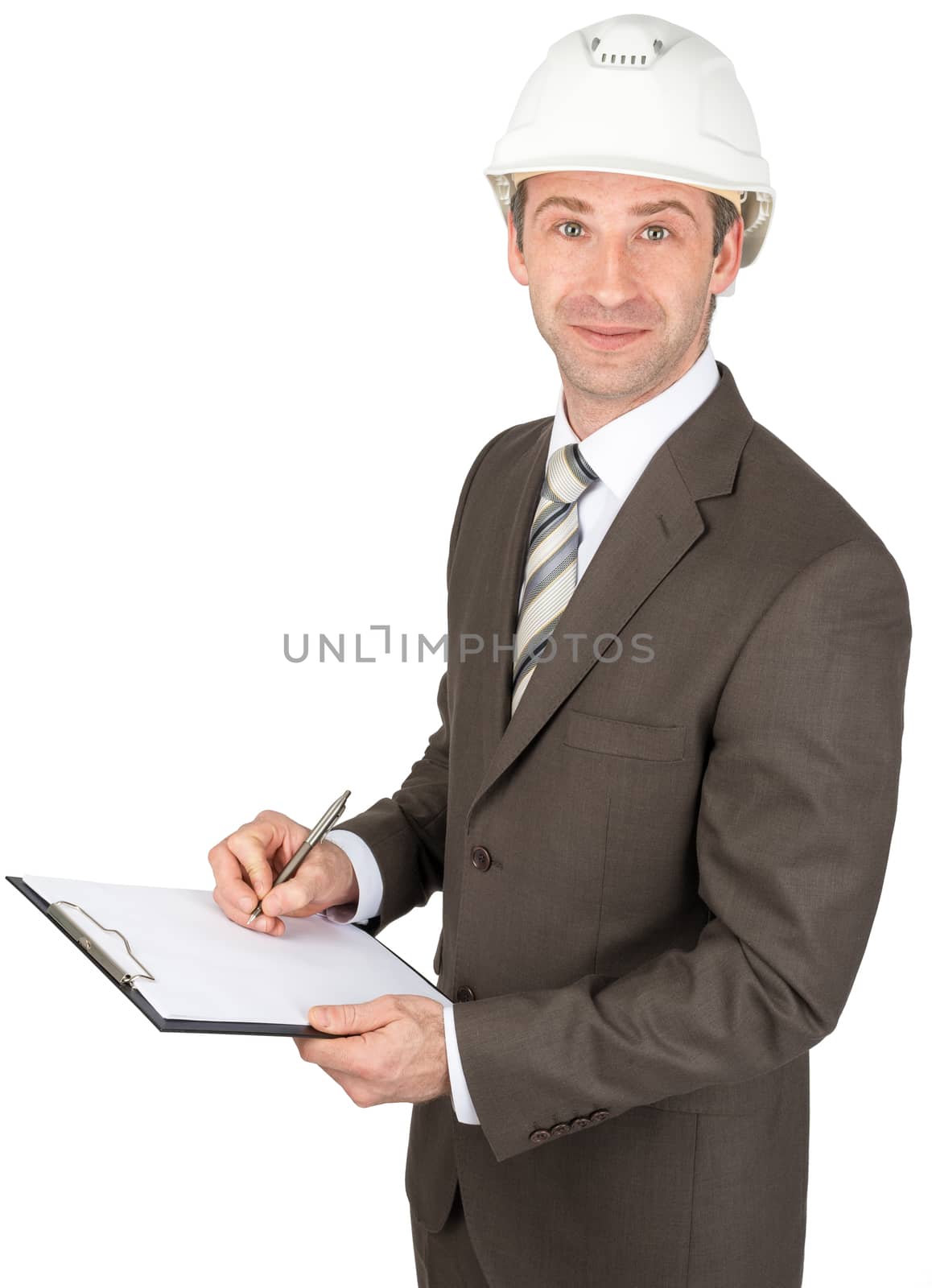 Smiling businessman in helmet holding papers and pen isolated on white background