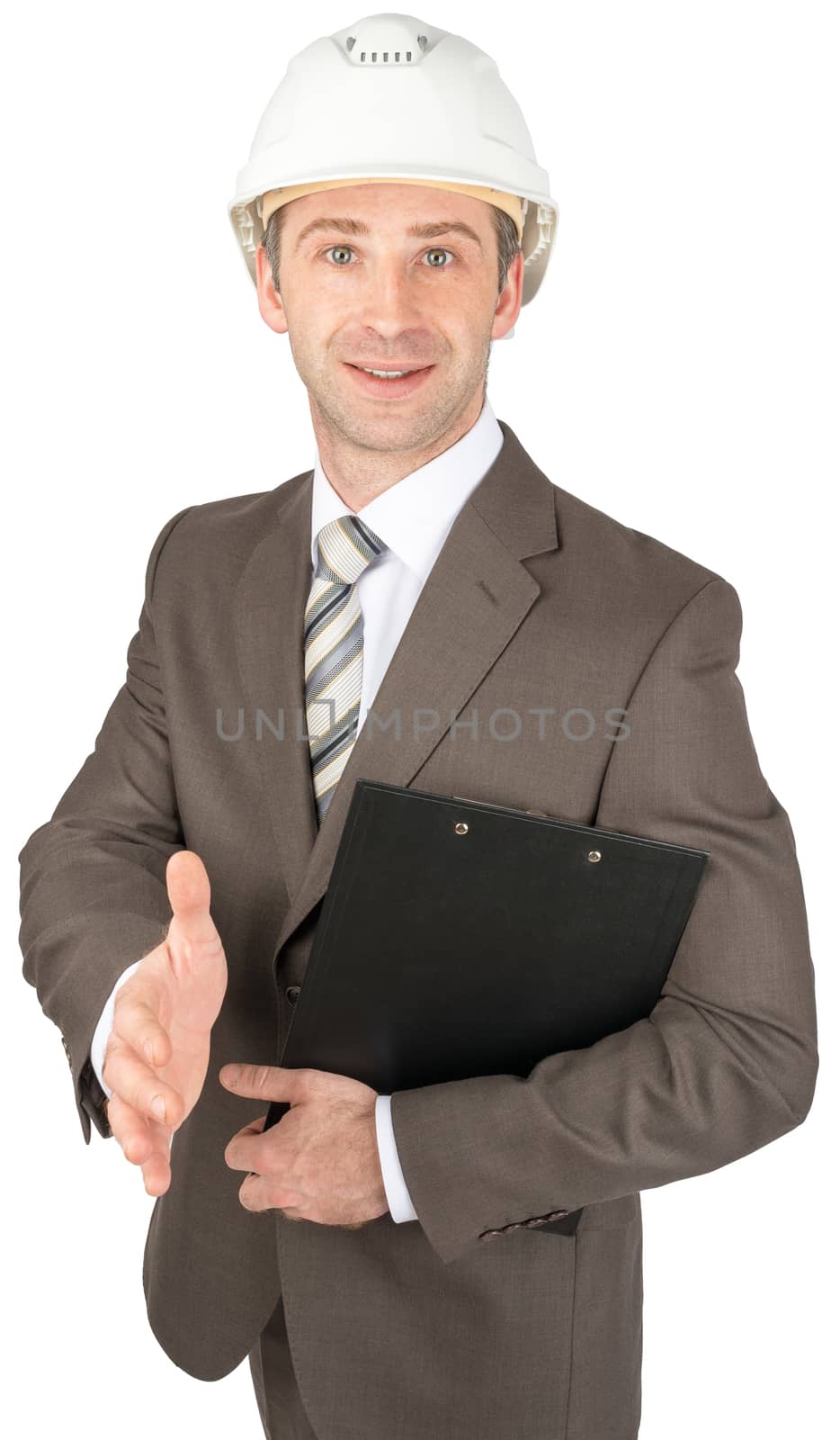 Smiling businessman in helmet holding papers and giving hand isolated on white background