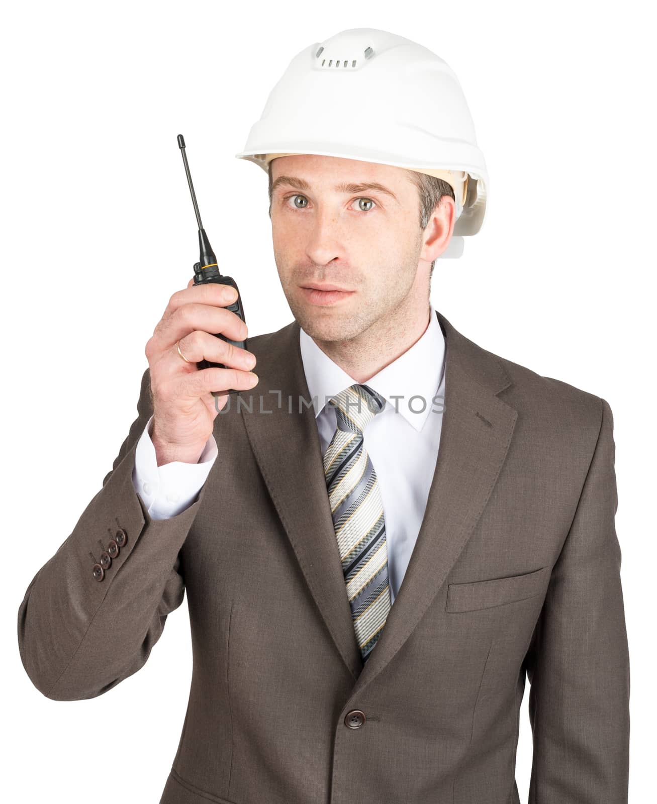 Businessman in helmet holding radio set isolated on white background