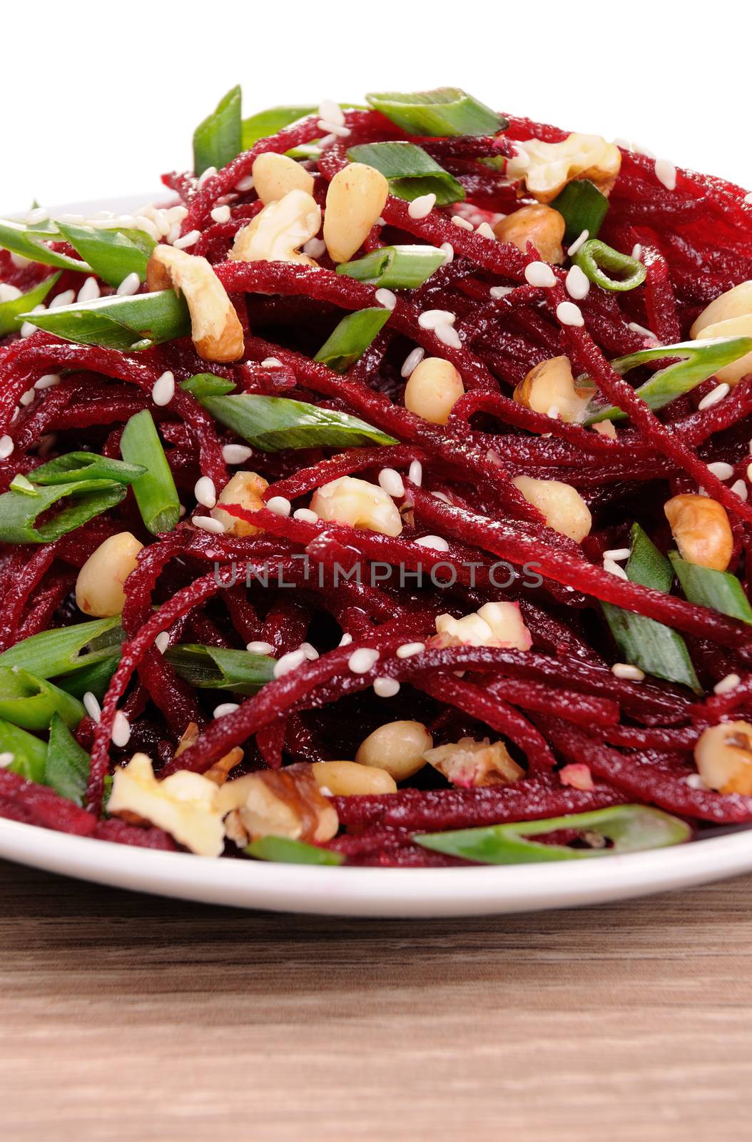 Salad of fresh grated   beets, onions flavored with nuts and sesame seeds