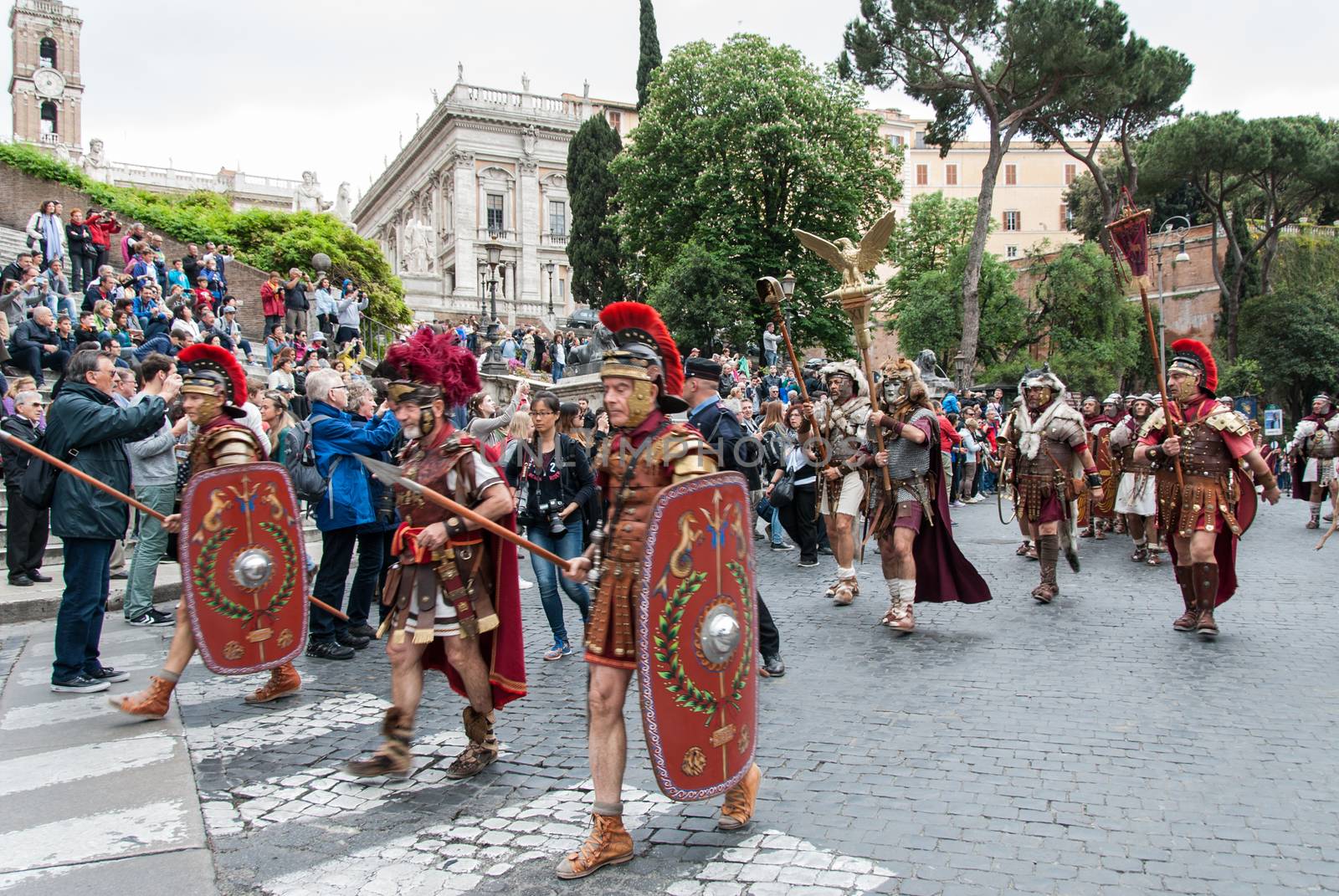 ITALY, Rome: Men dressed as ancient roman centurions parade near the Colosseum to commemorate the legendary foundation of the eternal city in 753 B.C, in Rome on April 24, 2016. 