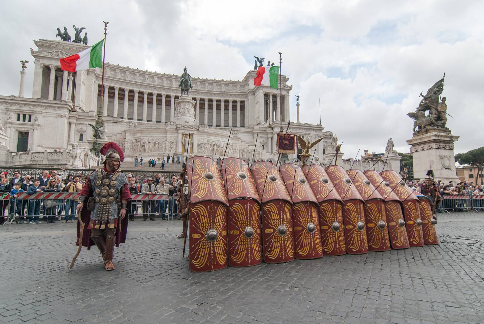 ITALY, Rome: Men dressed as ancient roman centurions parade near the Colosseum to commemorate the legendary foundation of the eternal city in 753 B.C, in Rome on April 24, 2016. 