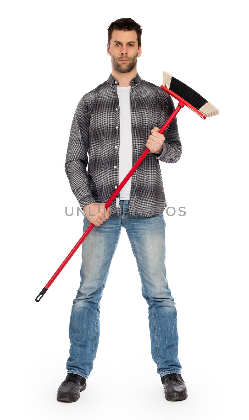 Full isolated studio picture from a young worker with a broom