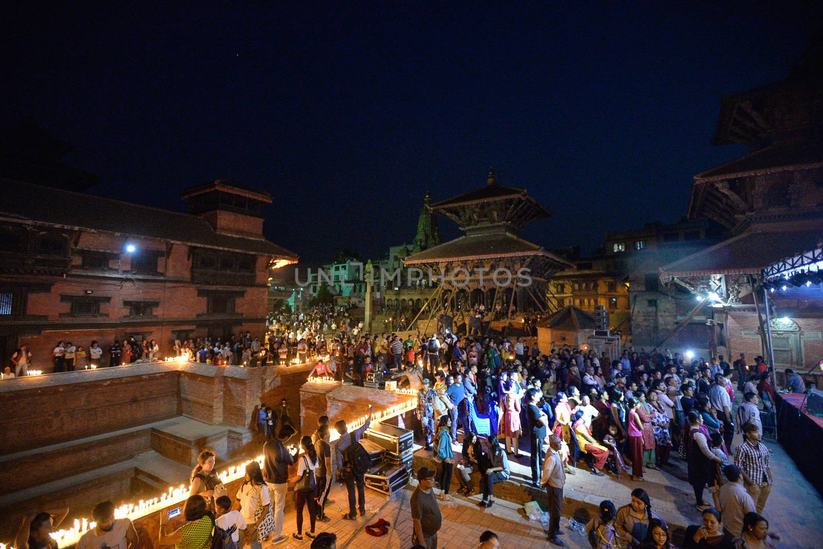 NEPAL, Patan: Nepalese residents gather to light candles during a vigil to mark the first anniversary of a devastating earthquake in Durbar Square in Patan, Kathmandu valley on April 24, 2016. Nepal on April 24 held services remembering thousands of people killed in a devastating earthquake one year ago, as authorities vow to expedite long-delayed reconstruction projects. Some 9,000 people were killed in the 7.8-magnitude quake that struck April 25, 2015 and its aftershocks.