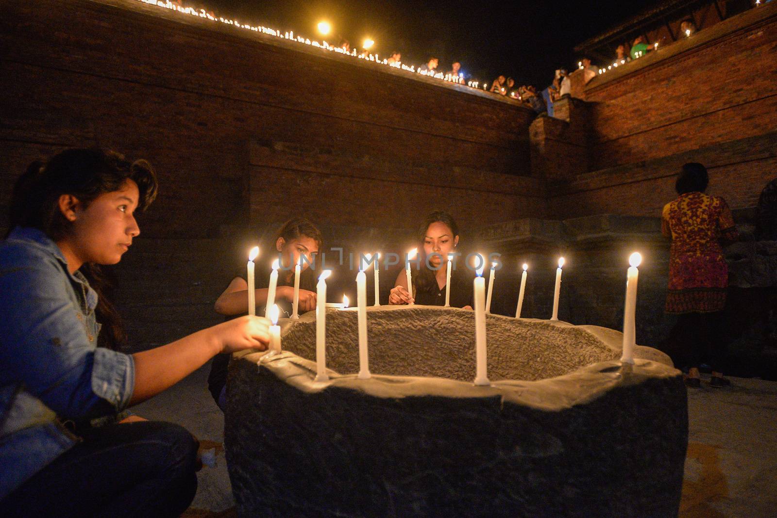 NEPAL, Patan: Nepalese residents gather to light candles during a vigil to mark the first anniversary of a devastating earthquake in Durbar Square in Patan, Kathmandu valley on April 24, 2016. Nepal on April 24 held services remembering thousands of people killed in a devastating earthquake one year ago, as authorities vow to expedite long-delayed reconstruction projects. Some 9,000 people were killed in the 7.8-magnitude quake that struck April 25, 2015 and its aftershocks.