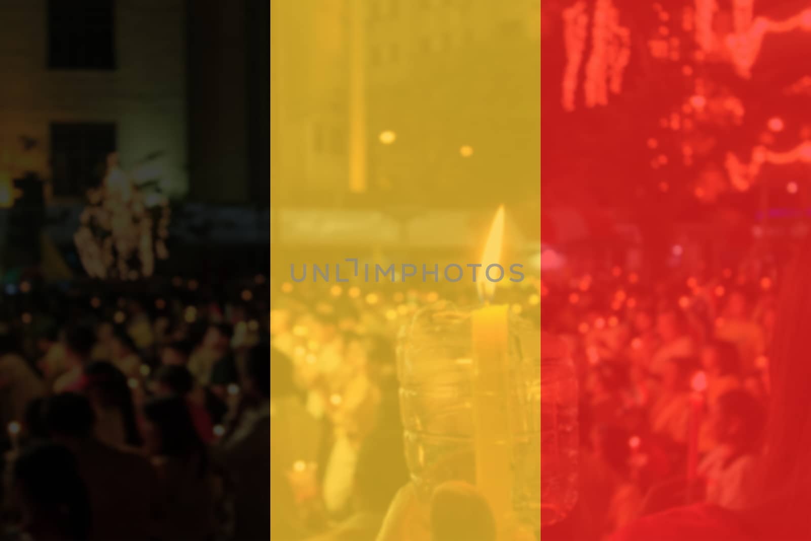 Belgium flag and people praying in background.
