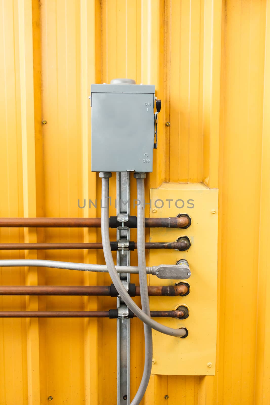 Electric safety switch with yellow background.