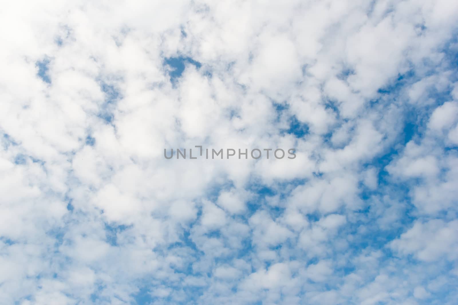 Cloudy day with blue sky.