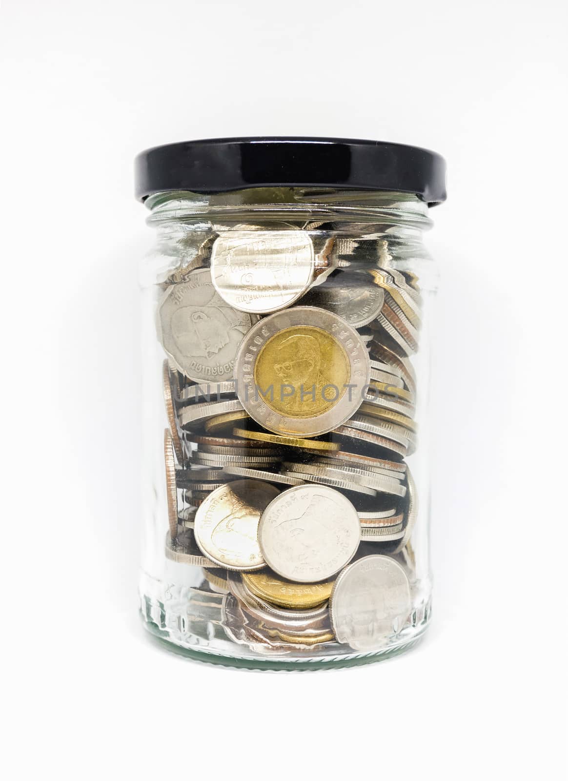 Thai coin in transparent jar on white background.