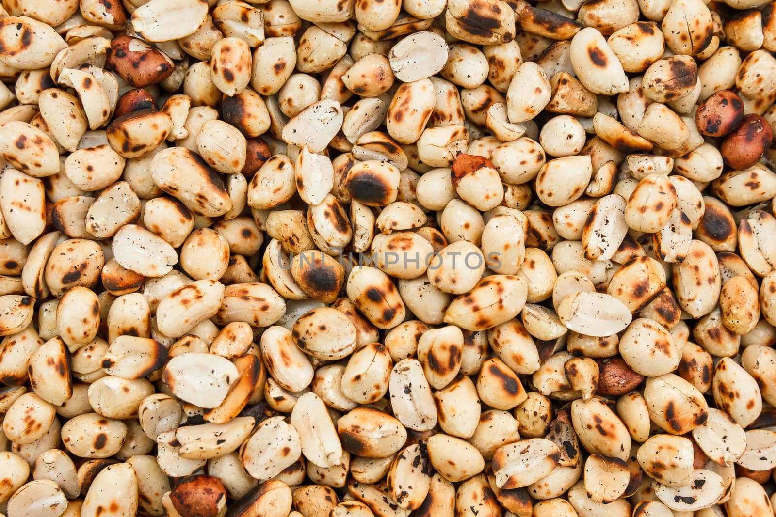 Pile of peeled roasted peanut.
