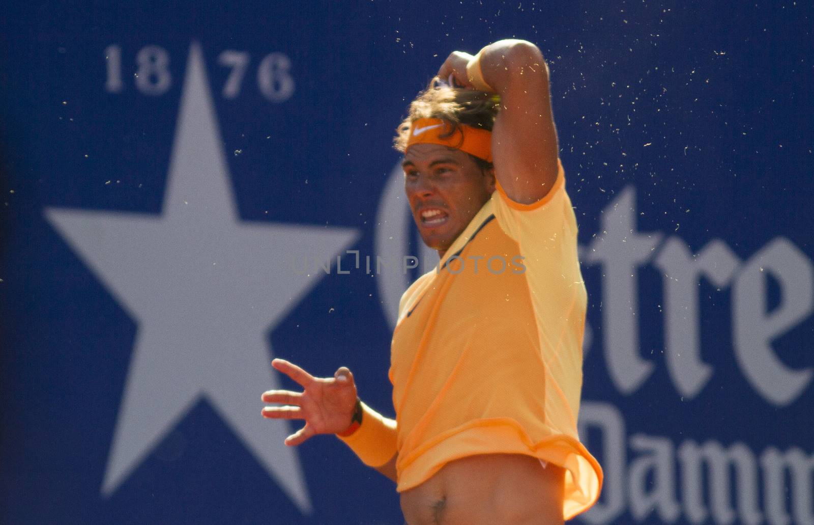 SPAIN, Barcelona: Spanish tennis player Rafael Nadal returns the ball to Japanese tennis player Kei Nishikori during the final of the ATP Barcelona Open Conde de Godo tennis tournament in Barcelona on April 24, 2015. Rafael Nadal equalled Argentine legend Guillermo Vilas's record of 49 clay-court titles with his ninth Barcelona Open after overcoming defending champion Kei Nishikori 6-4, 7-5 today. 