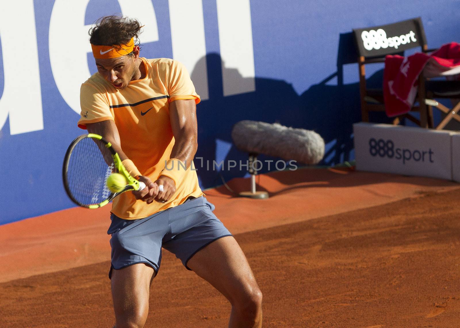 SPAIN, Barcelona: Spanish tennis player Rafael Nadal returns the ball to Japanese tennis player Kei Nishikori during the final of the ATP Barcelona Open Conde de Godo tennis tournament in Barcelona on April 24, 2015. Rafael Nadal equalled Argentine legend Guillermo Vilas's record of 49 clay-court titles with his ninth Barcelona Open after overcoming defending champion Kei Nishikori 6-4, 7-5 today. 