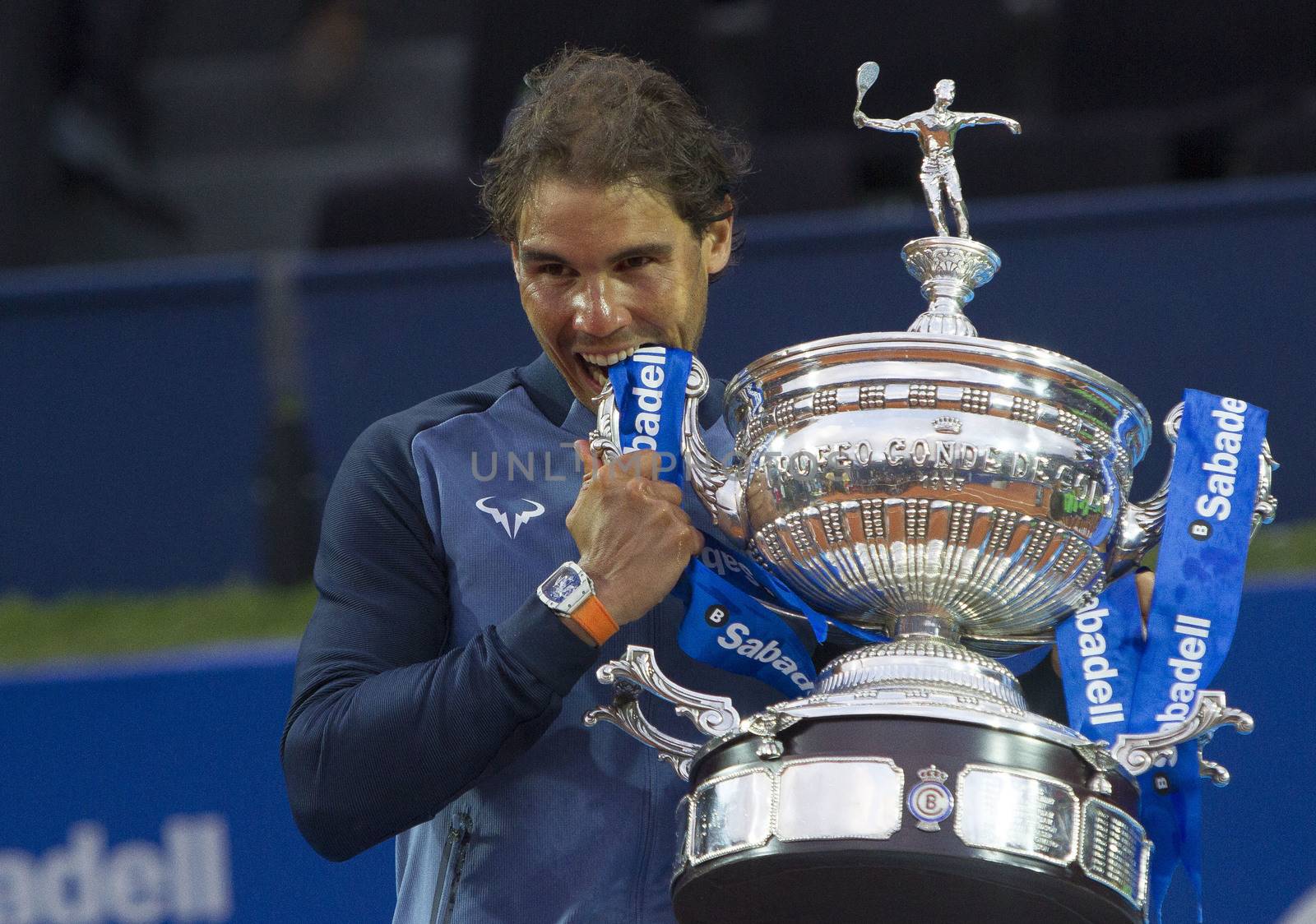 SPAIN, Barcelona: Spanish tennis player Rafael Nadal celebrates defeating Japanese tennis player Kei Nishikori during the final of the ATP Barcelona Open Conde de Godo tennis tournament in Barcelona on April 24, 2015. Rafael Nadal equalled Argentine legend Guillermo Vilas's record of 49 clay-court titles with his ninth Barcelona Open after overcoming defending champion Kei Nishikori 6-4, 7-5 today. 