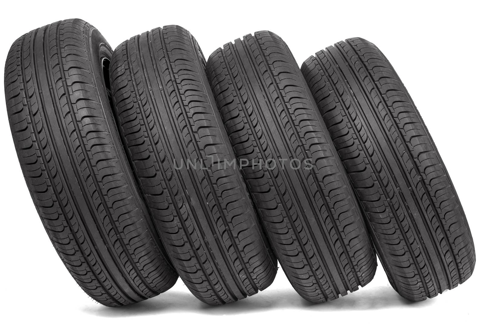 Four black tires. Isolated on white background
