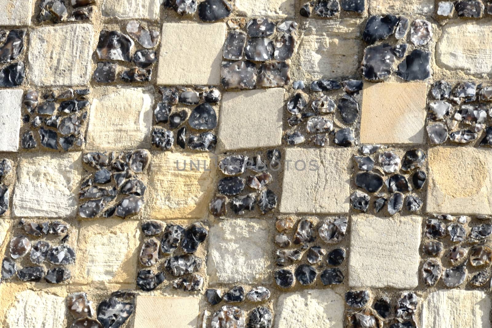 Chequerd stone detail on ancient  building by pauws99