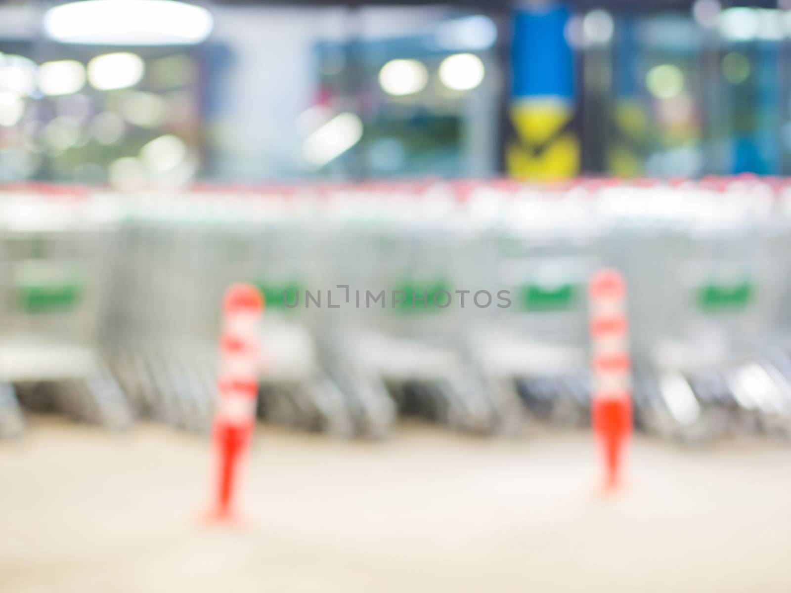 Blurred shopping carts on a parking lot by fascinadora
