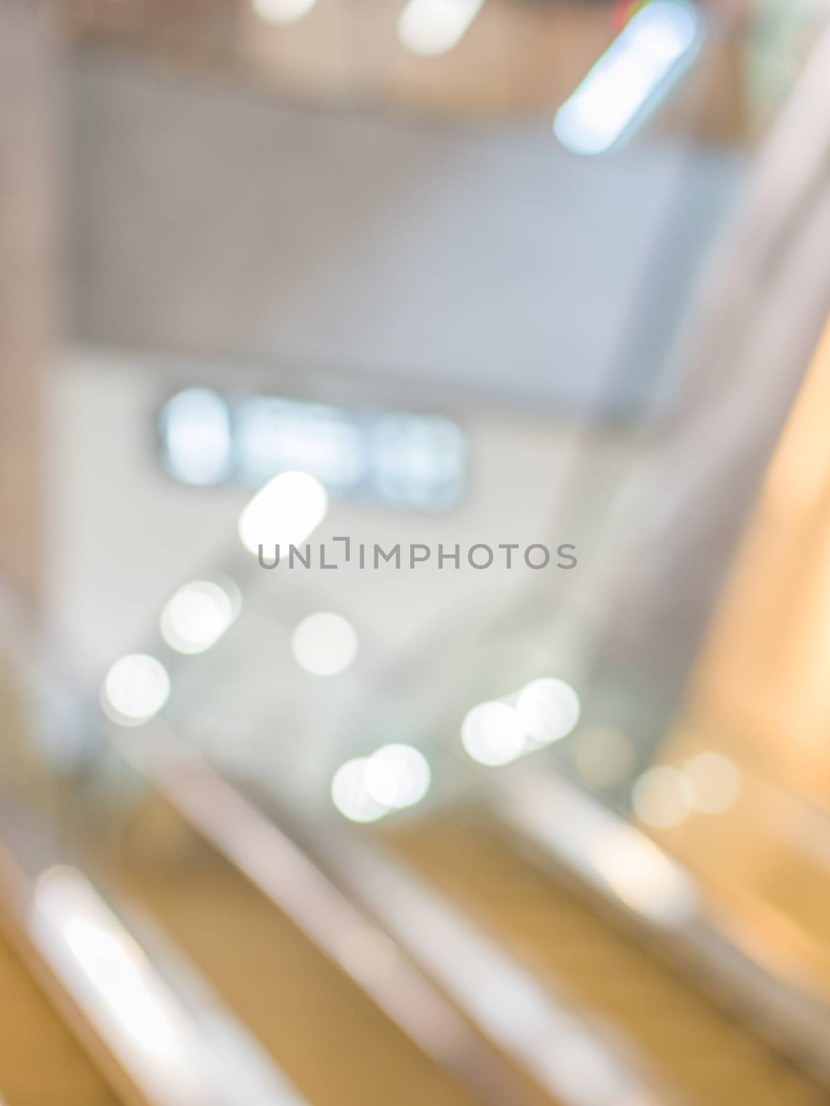 blurred escalator in shopping mall as background