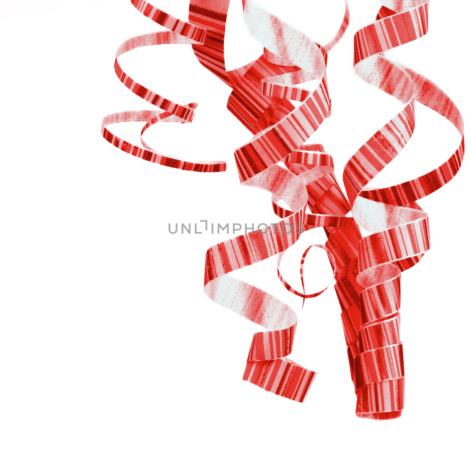 Arrangement of Striped Red Curly Hanging Party Streamers isolated on White background