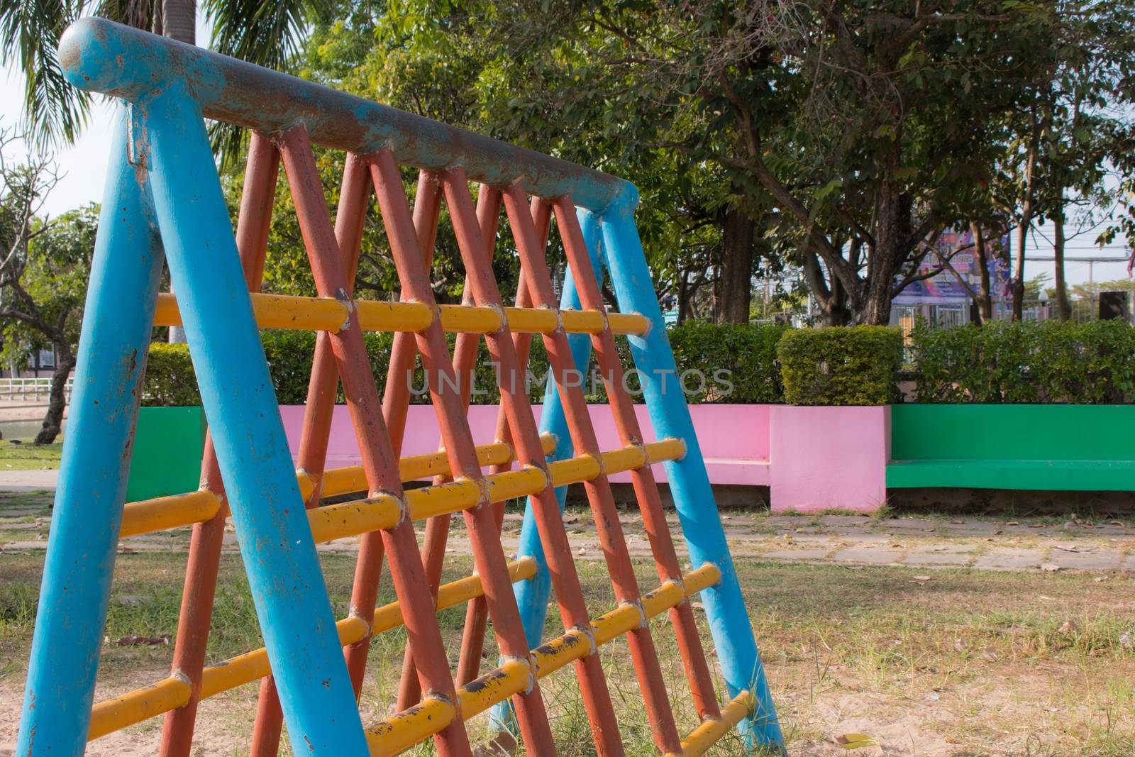 Climbing  fun playing on equipment at a playground.