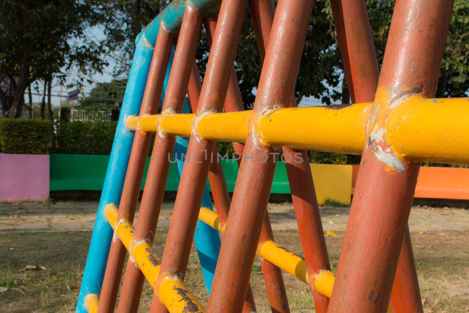 Climbing  fun playing on equipment at a playground.