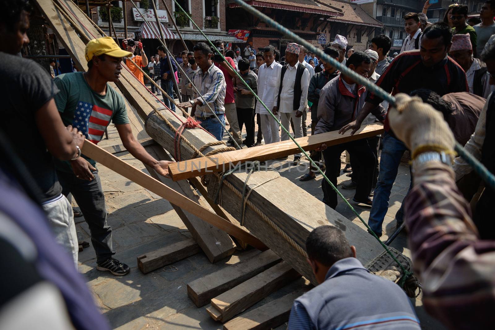 NEPAL, Kathmandu: Men begin rebuilding heritage sites damaged by the earthquake a year ago, on April 25, 2016, at Patan Durbar Square in Kathmandu, in Nepal, during the first anniversary of the quake.Some 9,000 people were killed in the 7.8-magnitude quake that struck April 25, 2015 and its aftershocks. . 