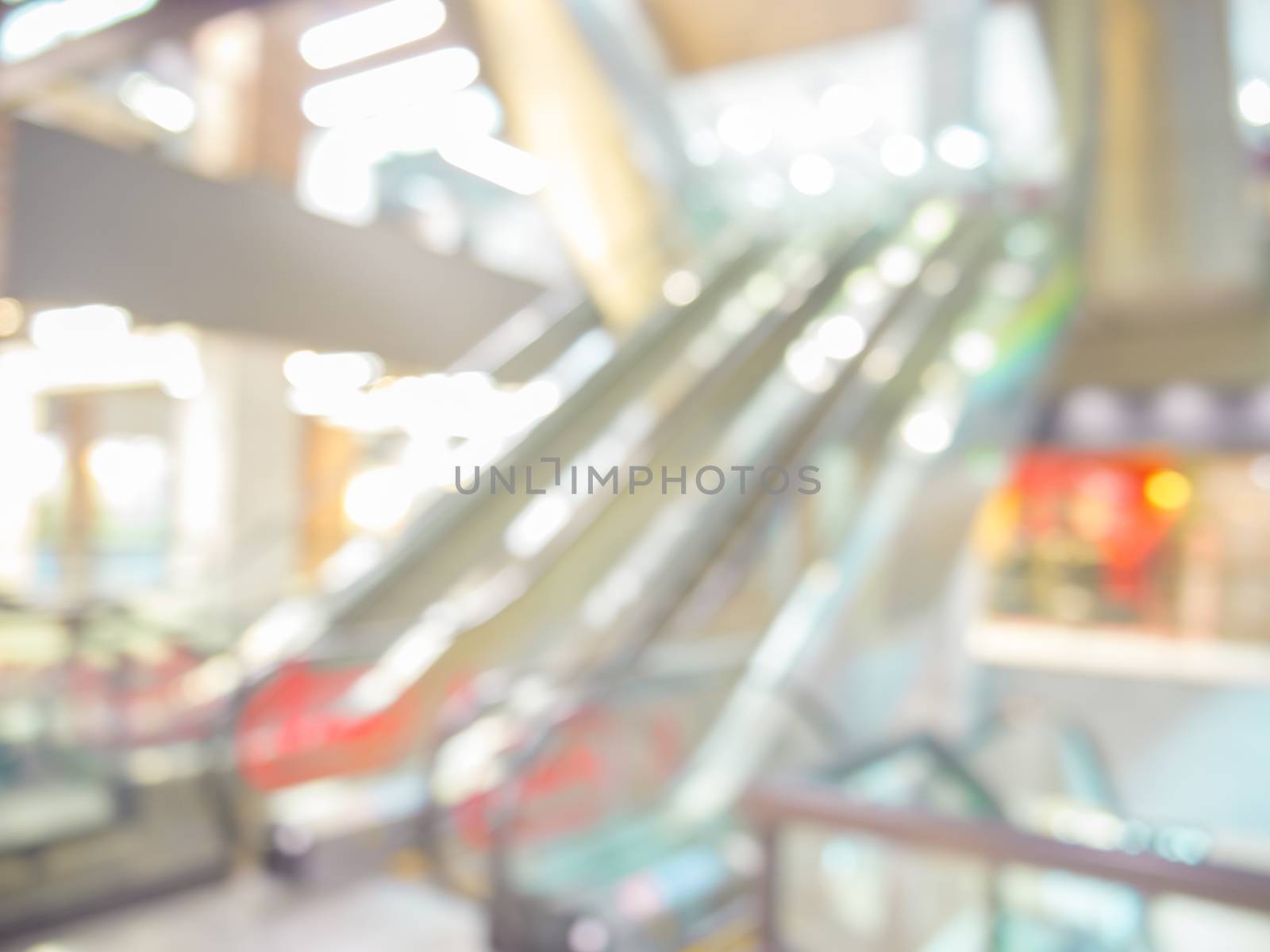 blurred escalator in shopping mall background by fascinadora