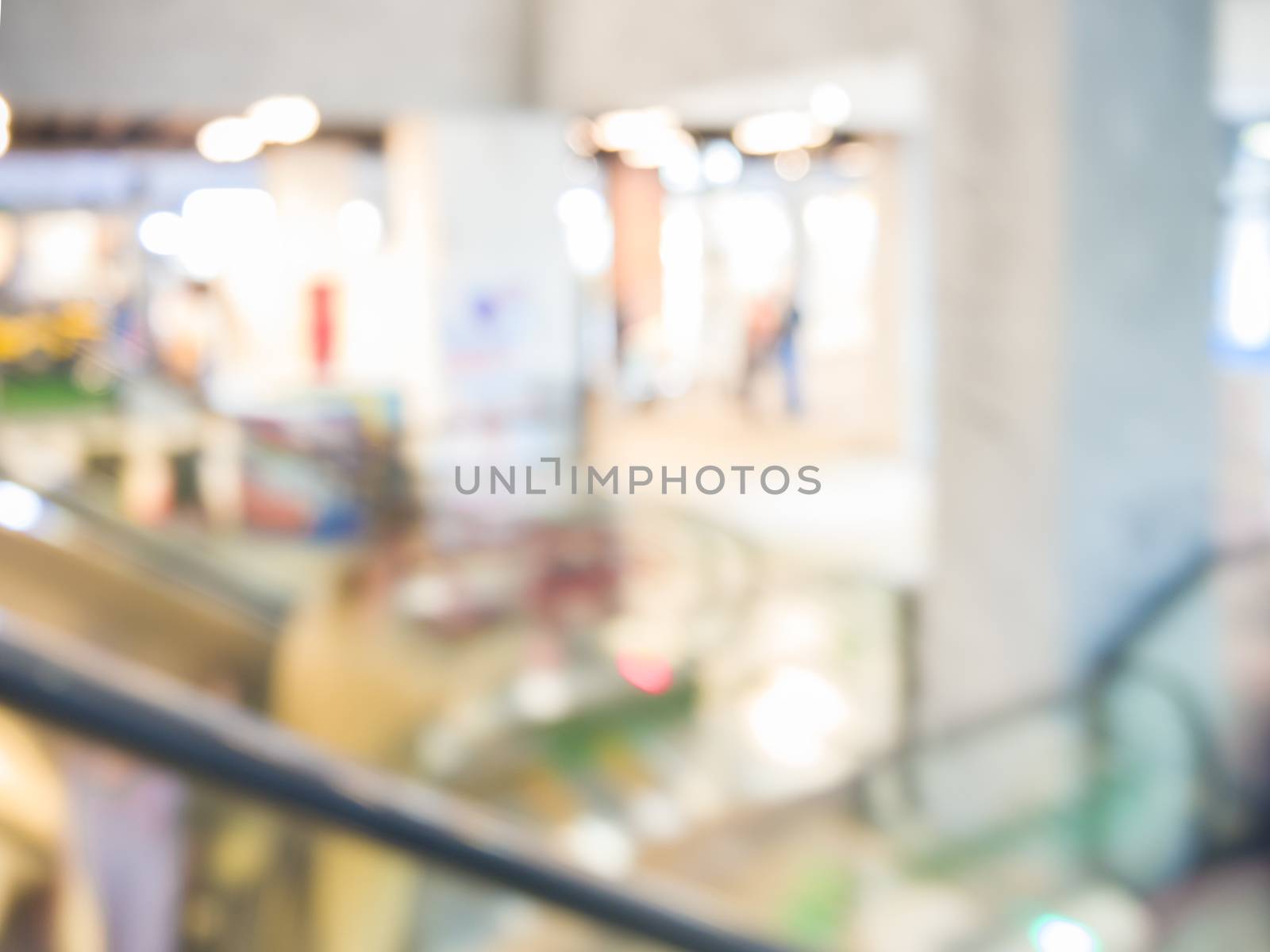 blurred escalator in shopping mall as background