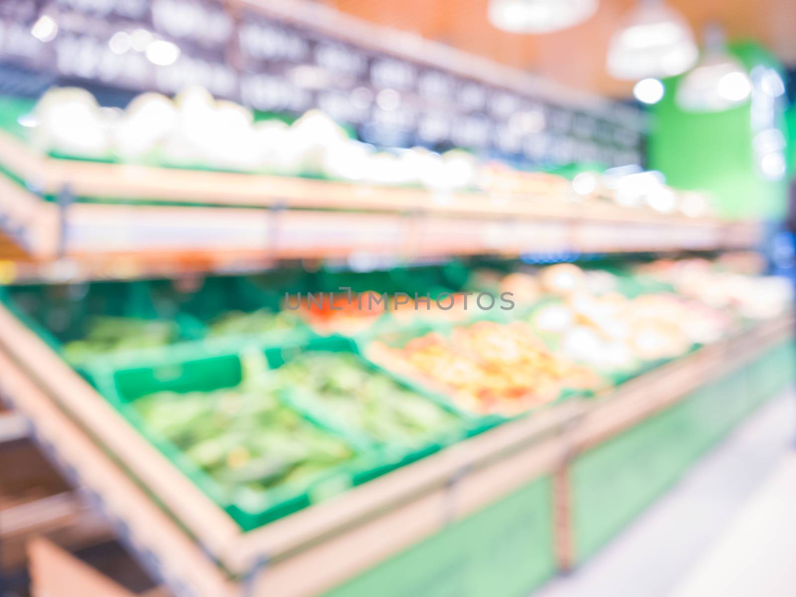 Blur of fresh fruits on shelf in supermarket. by fascinadora