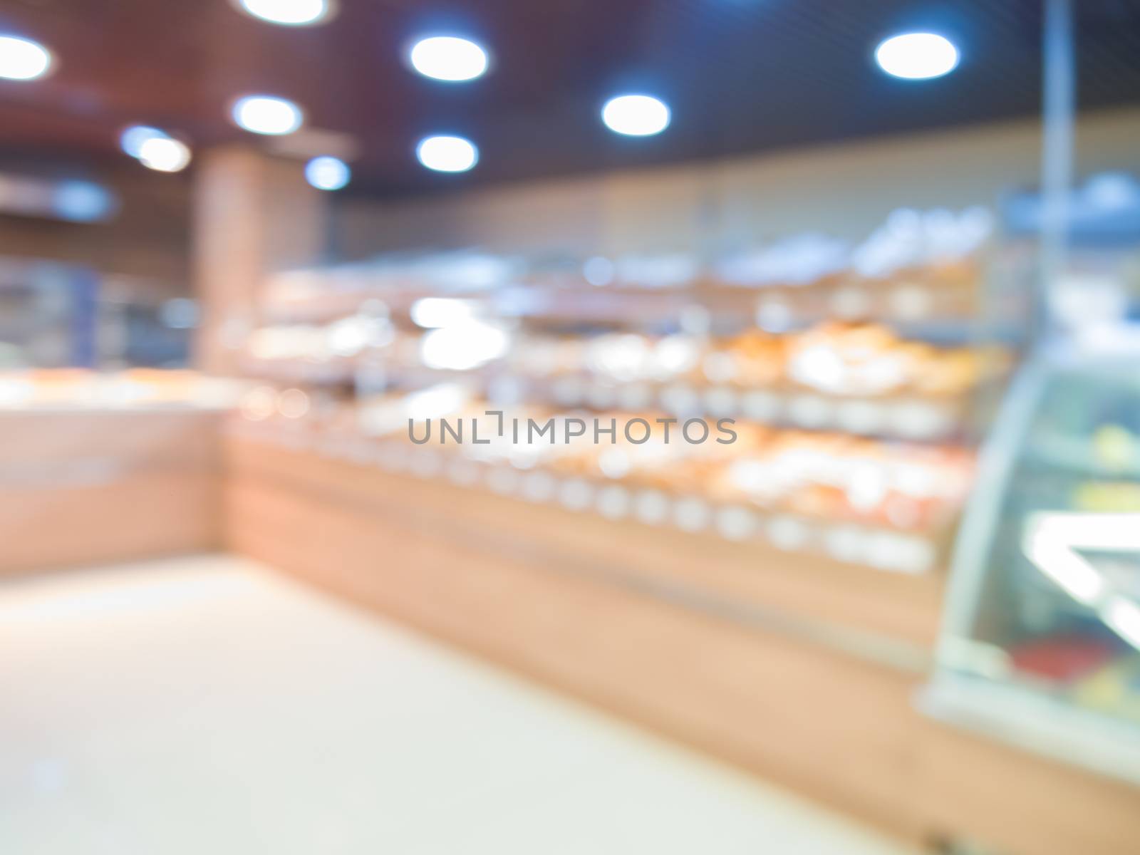 image of blur bakery shop with bokeh for background usage.