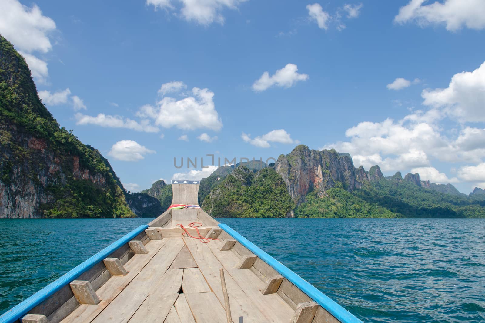 Beautiful mountains behind fog in Ratchaprapha Dam at Khao Sok National Park, Surat Thani Province, Thailand