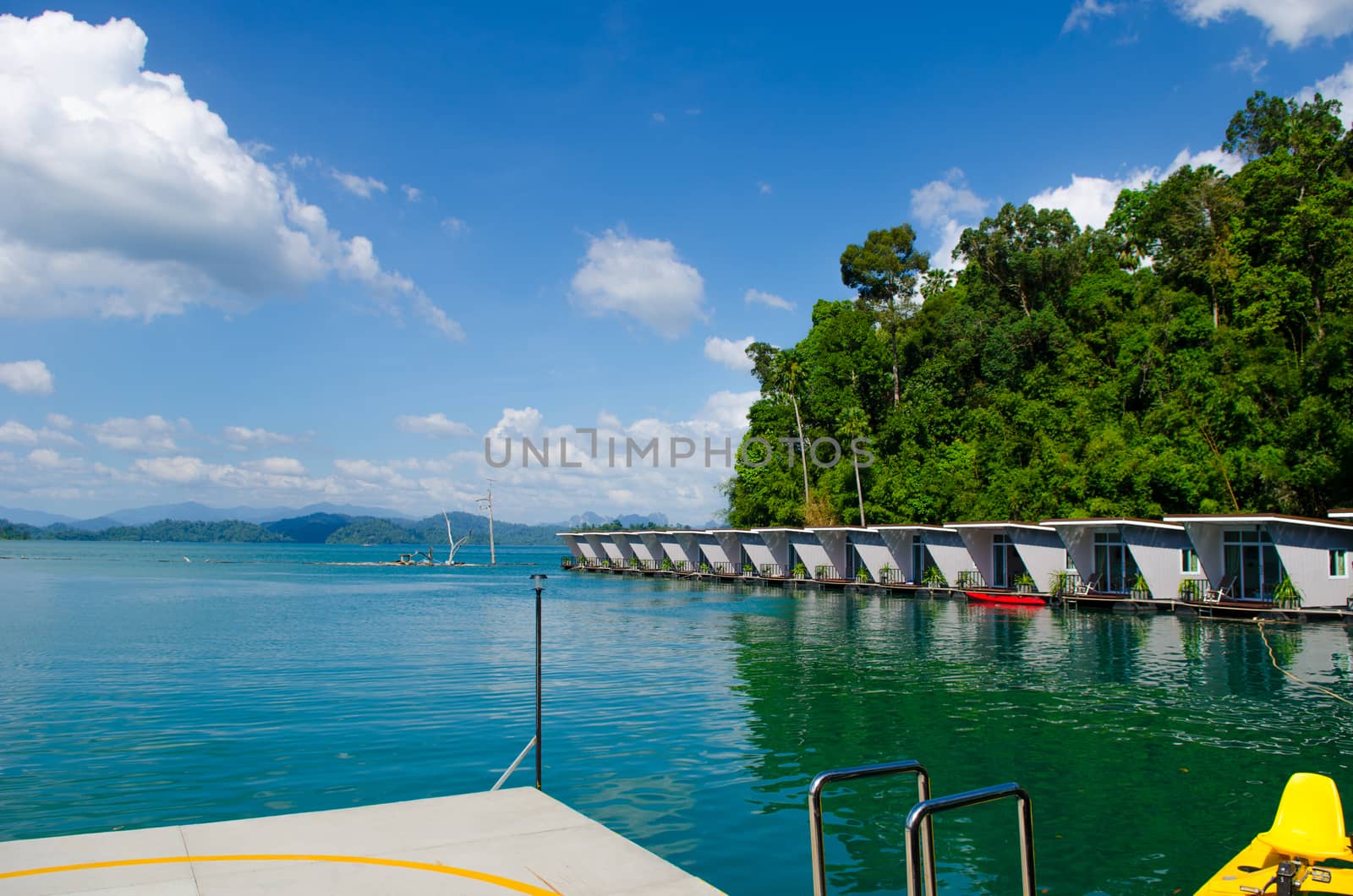 Ferry port and floating house with watercycle in Ratchaprapha Dam, Khao Sok National Park, Surat Thani Province, Thailand