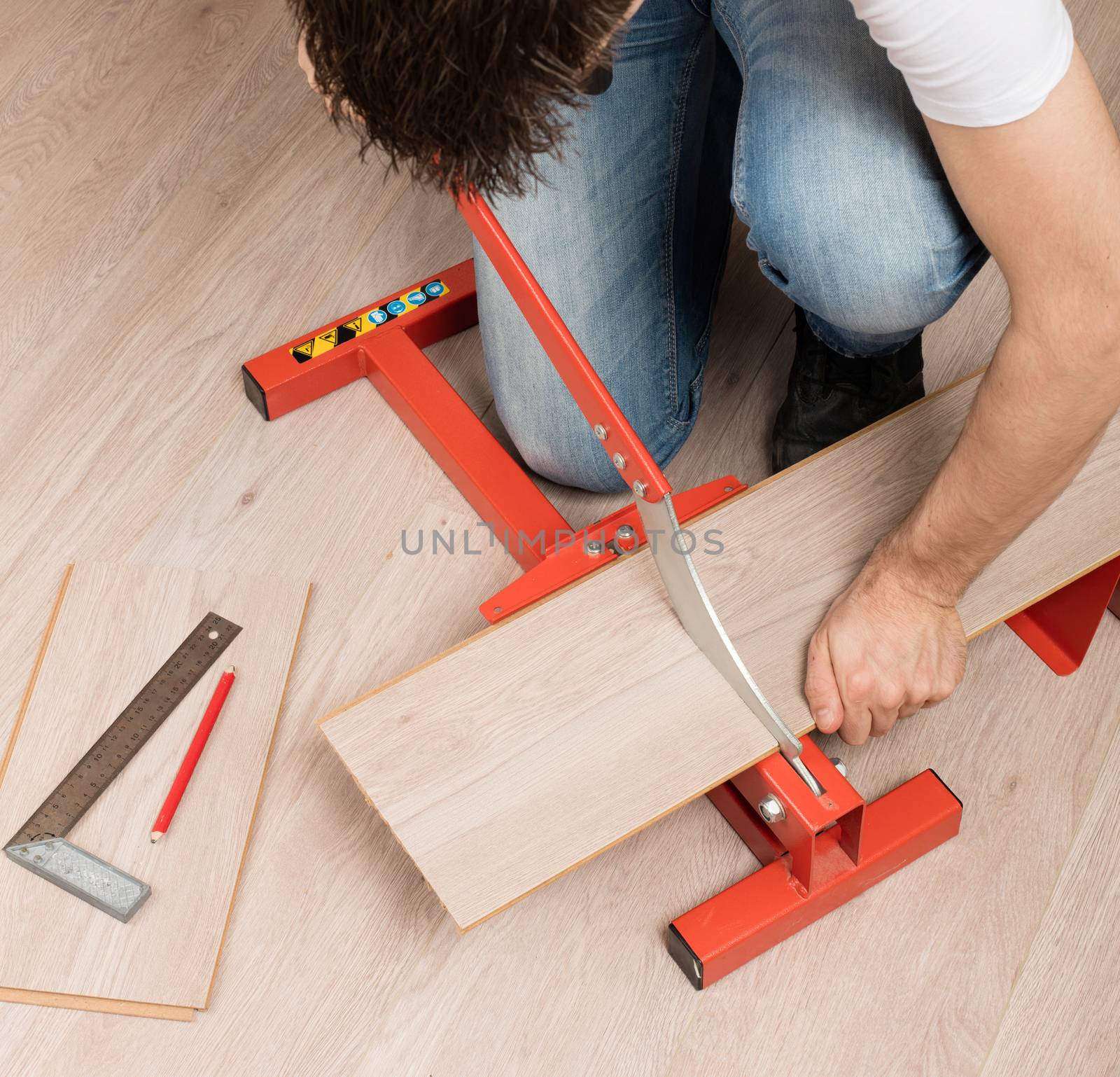 Red tool for cutting laminate by michaklootwijk