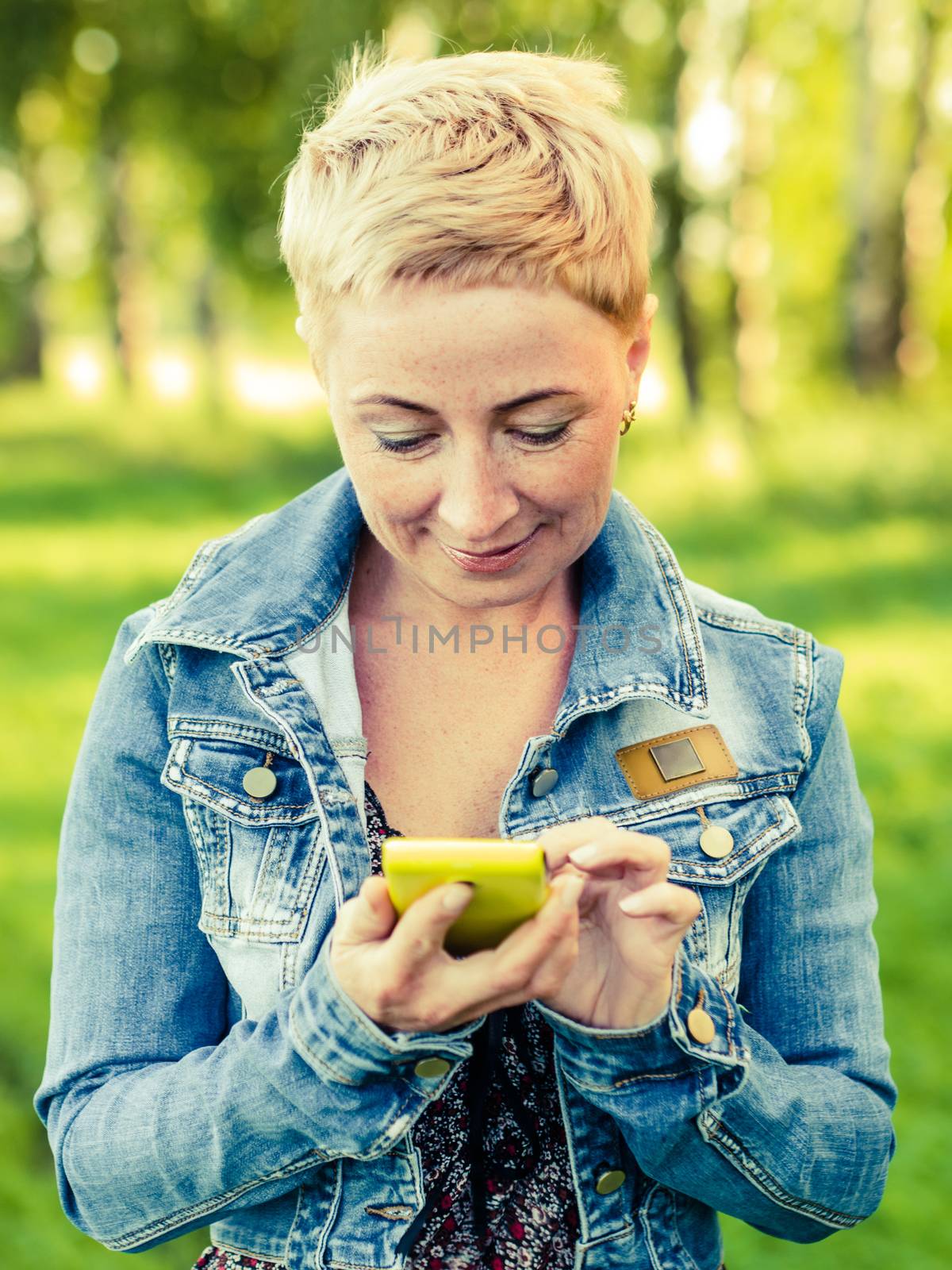 Mature Woman Typing on the Smartphone