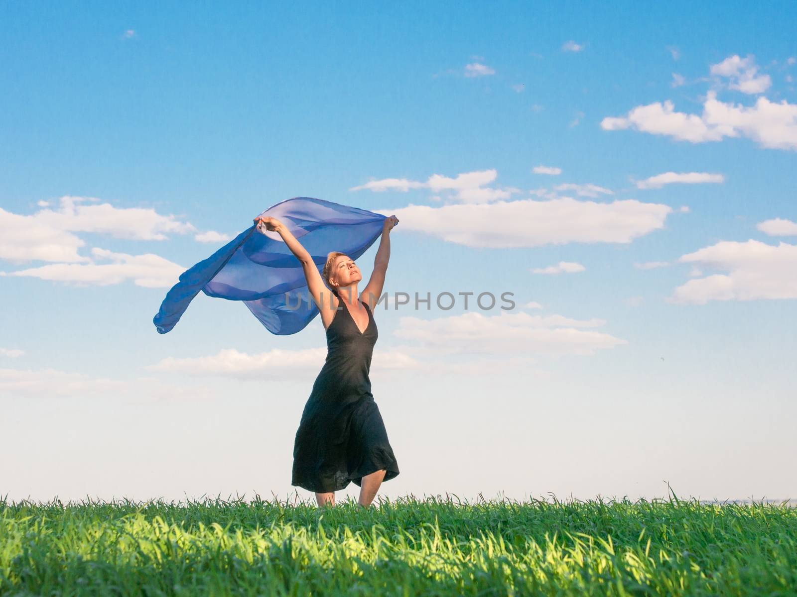 Woman with scarf in field
