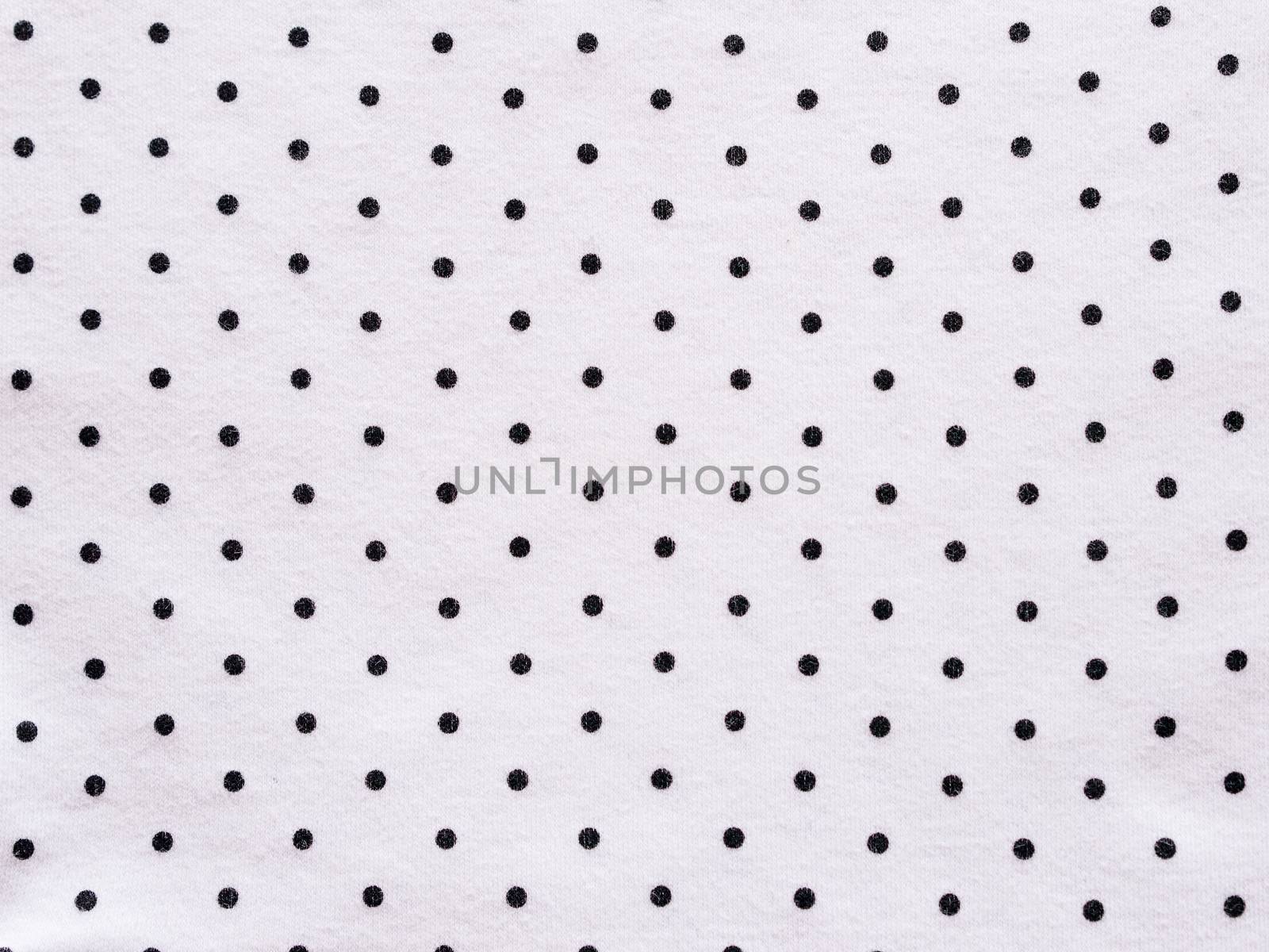 Black and white polka dot fabric background and texture