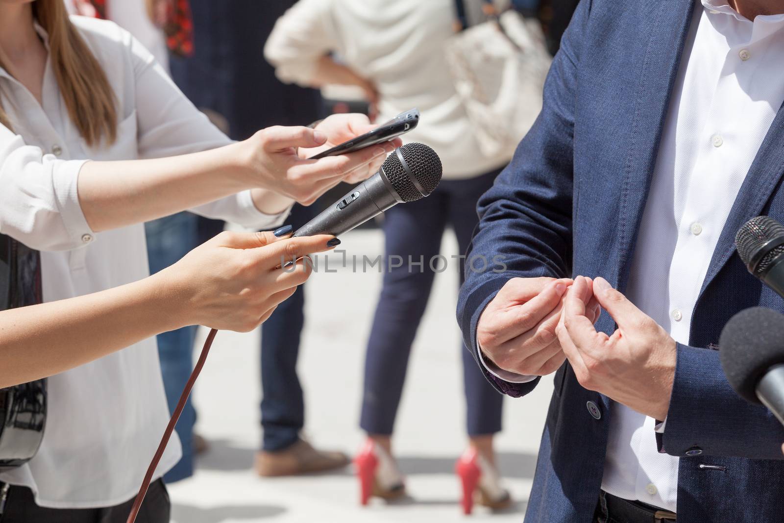 Reporters making interview with businessman or politician