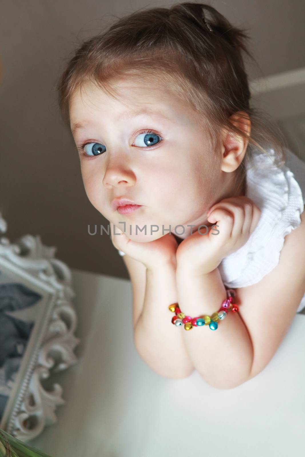 Beautiful small kid girl in studio