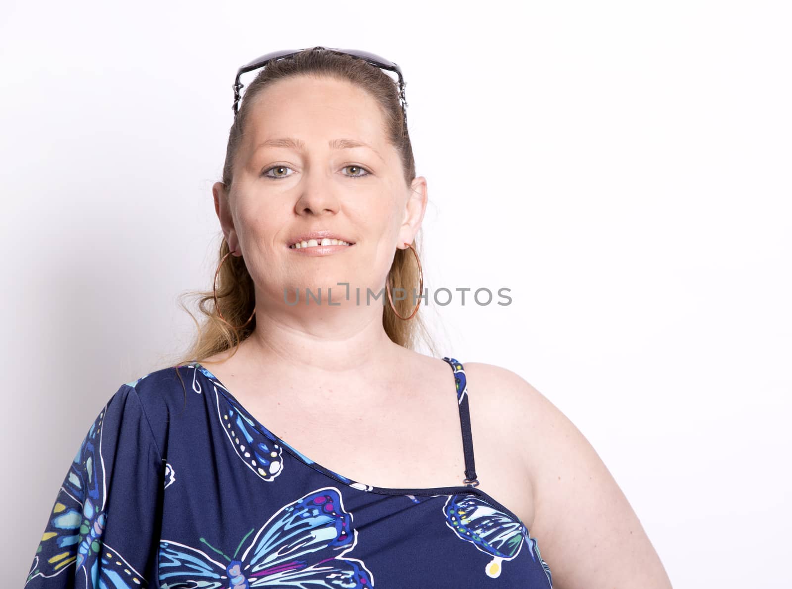 blond woman wearing summer outfit on white background