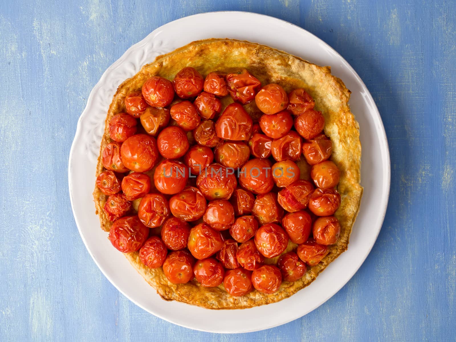 close up of rustic cherry tomato tarte tatin