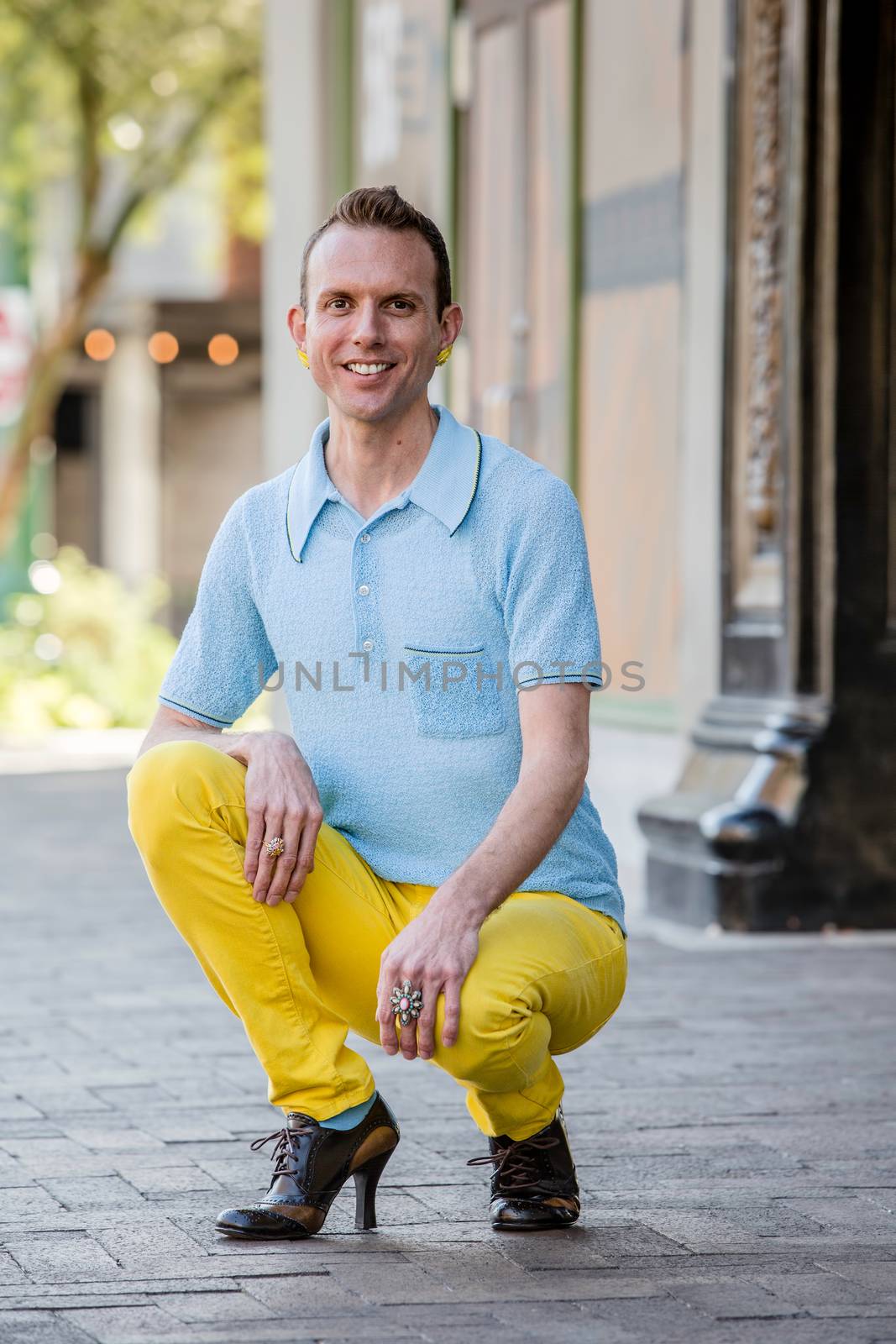 Handsome young gender fluid man in downtown setting