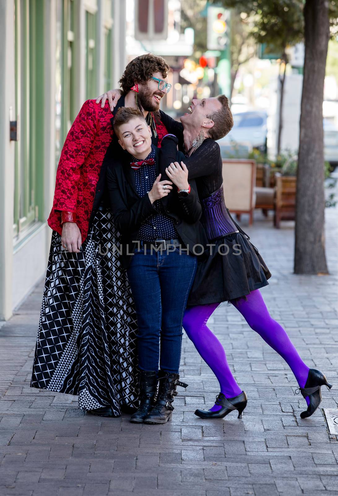 Attractive gender fluid trio of young friends