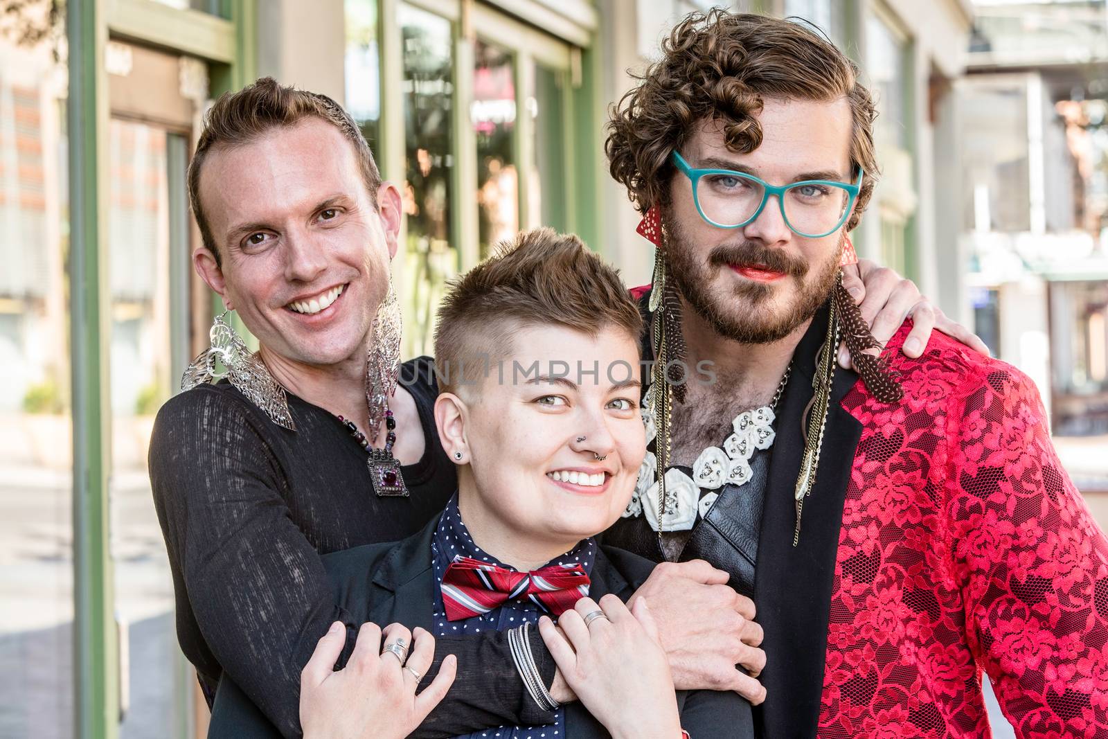 Happy gender fluid trio of young friends