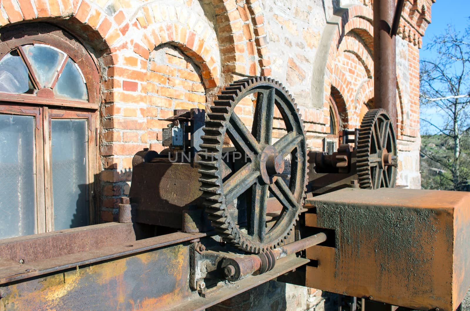 Old rusty gears, machinery parts.