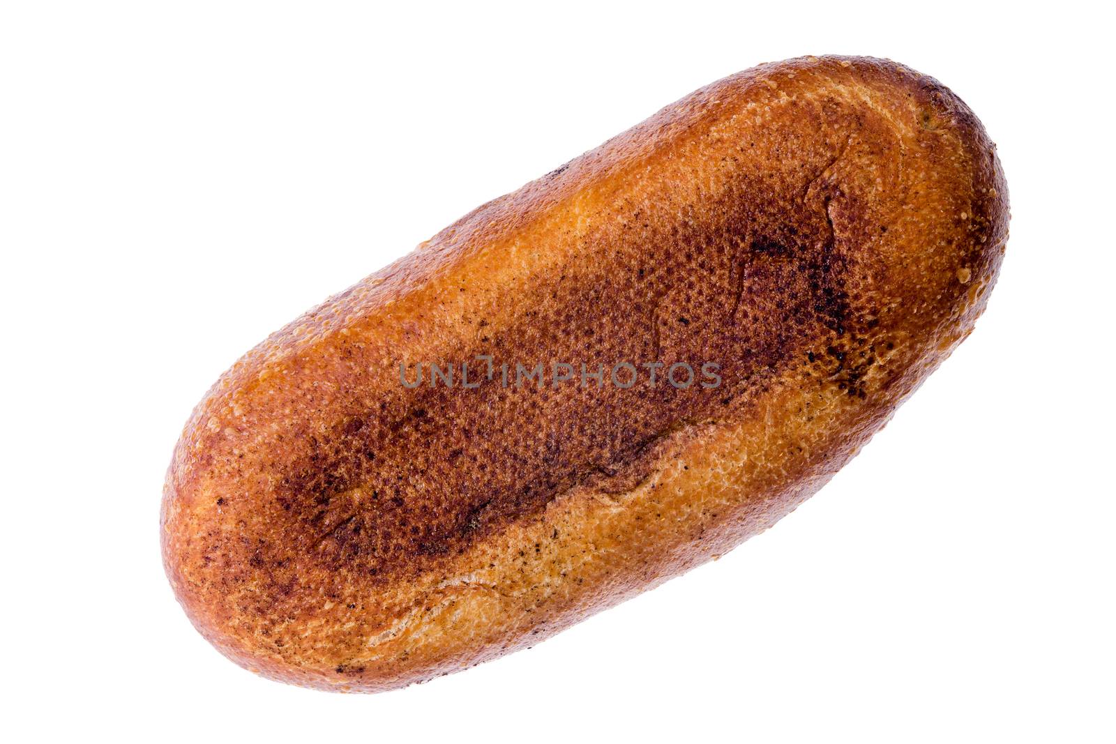 Underside of a rounded loaf of freshly baked sourdough bread arranged diagonally on a white background viewed form above