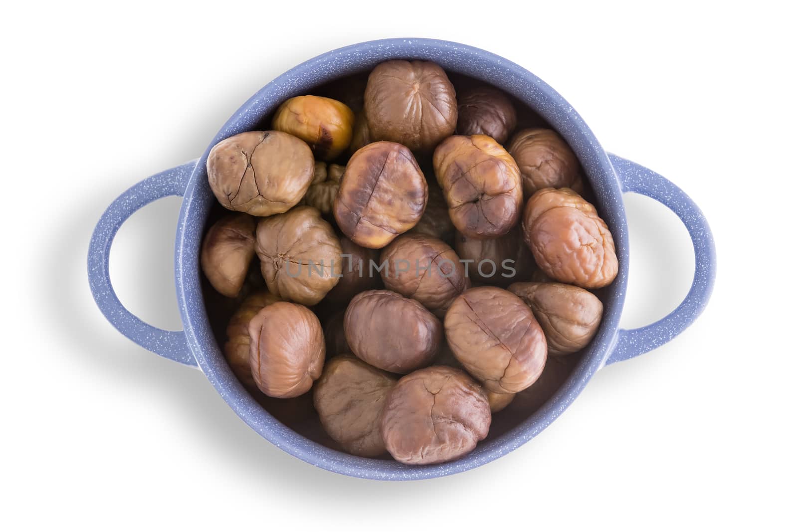 Blue earthenware bowl full of fresh roasted chestnuts harvested during autumn and fall for a tasty healthy seasonal snack viewed from overhead on a white background