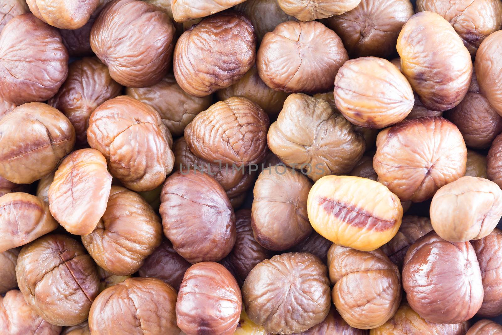 Full frame texture of roasted chestnuts by coskun