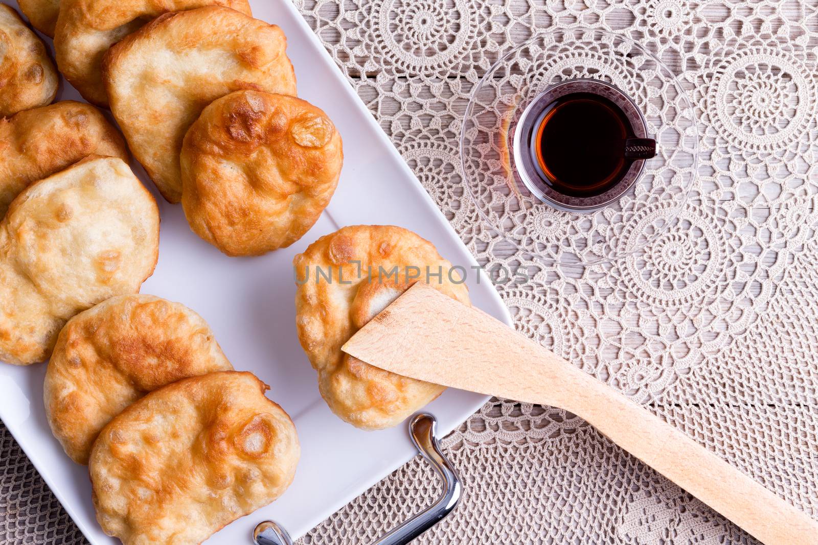 Turkish tea served with pisi halka or fried dough by coskun